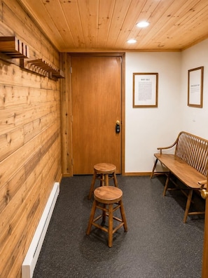 A wooden interior with a door, two stools, and a bench. - Hutch 1- 2 Min Walk to Slopes, Great Mountain View (Slaty Fork)