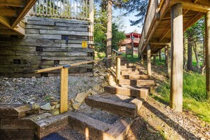 A wooden staircase leading to a cabin with a wooden exterior and a yellow caution sign. - Hutch 1- 2 Min Walk to Slopes, Great Mountain View (Slaty Fork)