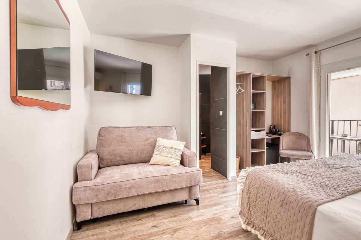 Superior Triple Room, Partial Sea View | Minibar, in-room safe, desk, laptop workspace