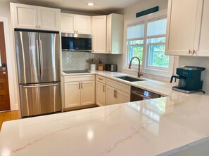 Fridge, microwave, oven, stovetop - The Madison Suite - Chesapeake Properties (Cape Charles)