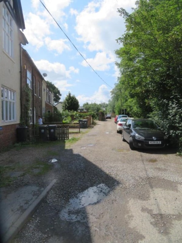 A residential street with houses on one side and parked cars on the other. - 2 Railway Terrace (Hurworth Place)