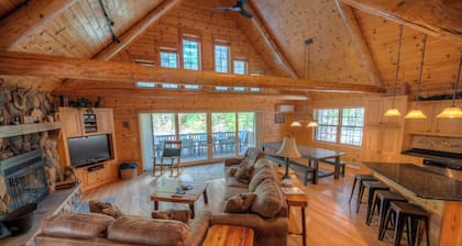 Exceptional log home on 9+ acres with frontage on Big St. Germain Lake