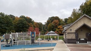 A playground with climbing structures and a picnic shelter. - Hot tub, Nature, Parks and Beaches! Right in between Holland and Grand Haven. (West Olive)