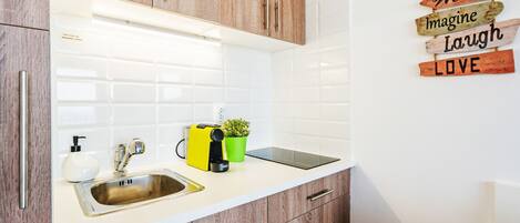 Fridge, coffee/tea maker, electric kettle, cookware/dishes/utensils