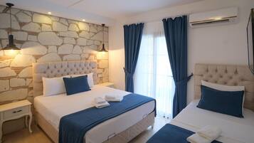 Familiekamer, 1 twee- of 2 eenpersoonsbedden | 1 slaapkamer, luxe beddengoed, gratis wifi, beddengoed