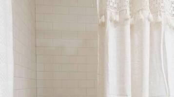 Bathtub, hair dryer, towels