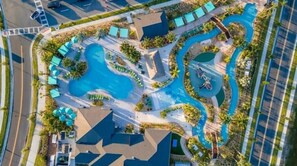 An aerial view of a resort with multiple swimming pools, lounge areas, and palm trees. - Hot tub 6BR/5BA Free Water Park - Storey Lake - 15Mins to Disney&EV Charge Free (Kissimmee)
