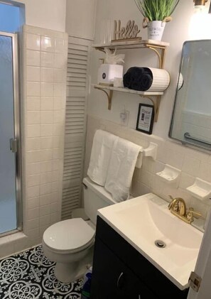 Shower, hair dryer, towels, soap
