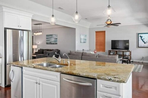 Bright, open concept, lakefront house on open water with amazing sunset views! 