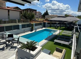 Seasonal outdoor pool, open 10:00 AM to 7:30 PM, pool umbrellas