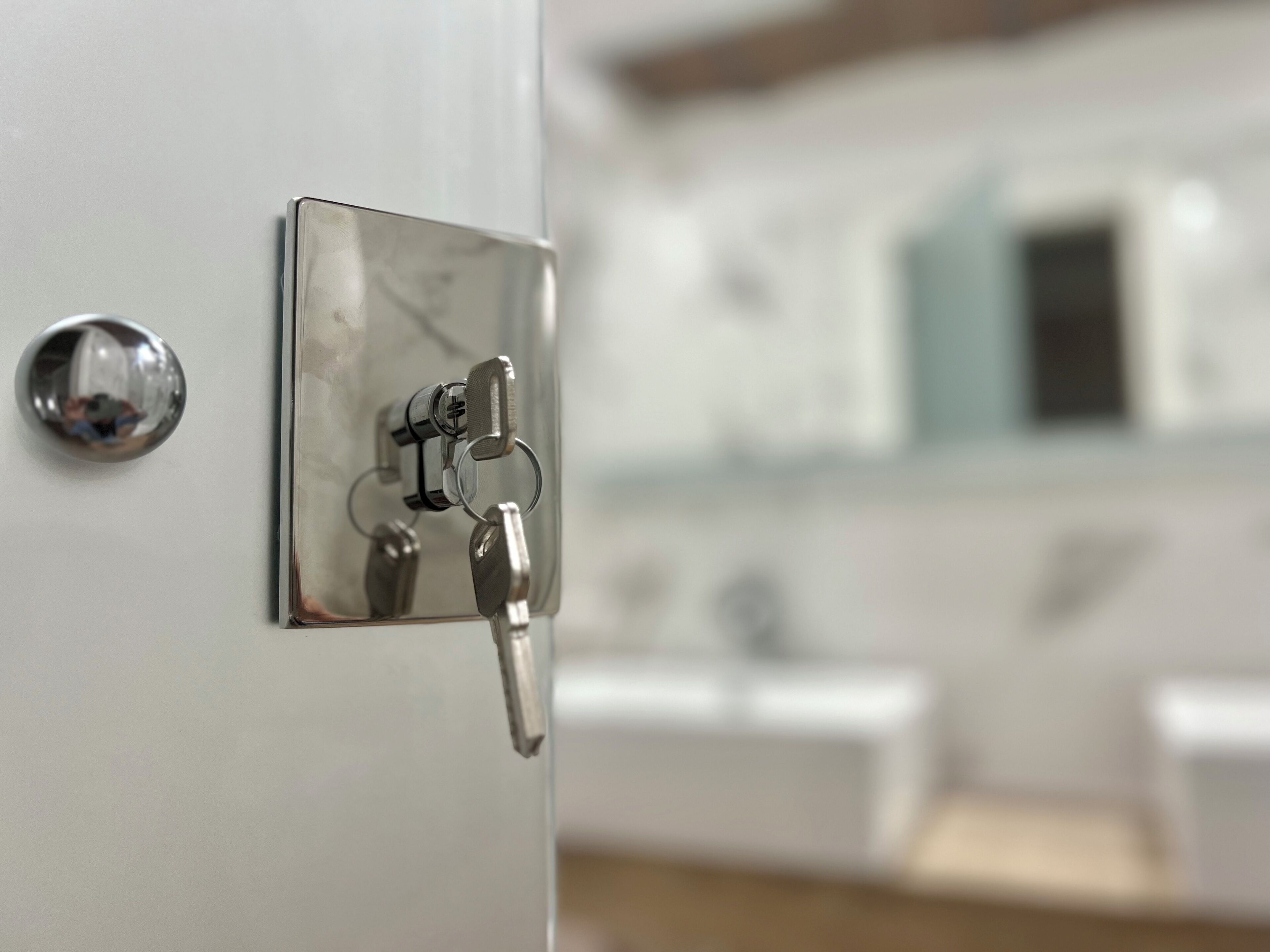 A bathroom with a modern faucet and a mirror.