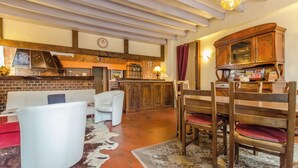 A cozy interior with a kitchen, dining area, and seating space.