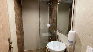 Shower, designer toiletries, hair dryer, towels