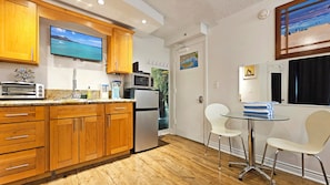 Fridge, microwave, stovetop, coffee/tea maker - Our comfortable suite at the Waikiki Grand Hotel® (Honolulu)