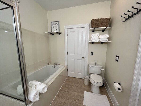 Bathtub, jetted tub, hair dryer, towels
