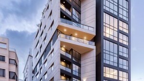 A modern multi-story building with balconies and large windows. - Modern apartment in Quito (Quito)
