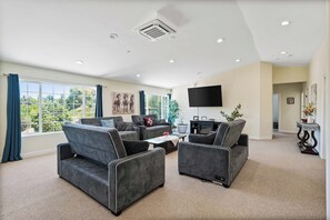 Smart TV, fireplace, foosball, books