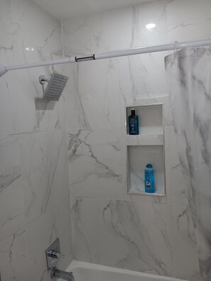 Shower, hair dryer, towels, soap