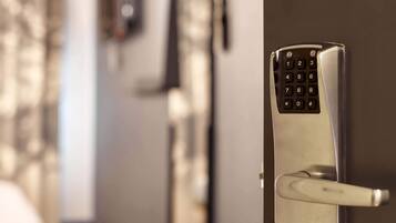 A modern door with a built-in keypad lock.