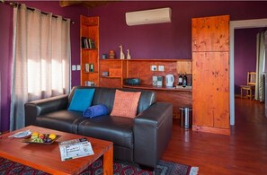 Living area - ENTIRE cozy farm resort with a ocean view right out side your terrace W/4 BDRM
(Cape Town)