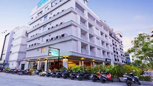A multi-story hotel with a prominent sign for 'Garden Phuket Hotel'. - Garden Phuket Hotel (Patong)