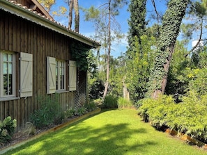 A wooden house with a sloped roof and shuttered windows. - Top located Cap Ferret style villa + Jacuzzi A0379 (Lège-Cap-Ferret)