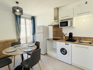 Fridge, microwave, stovetop, coffee/tea maker