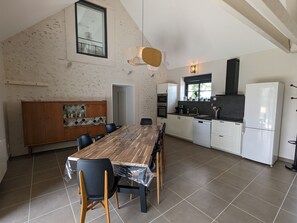 Enjoy meals in the spacious kitchen and dining area with oven and dishwasher, and take in the view from the window.