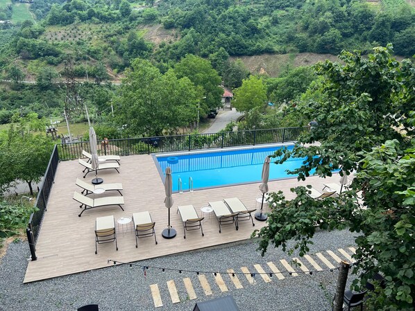 Seasonal outdoor pool, pool umbrellas, pool loungers