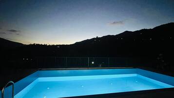 Seasonal outdoor pool, pool umbrellas, pool loungers
