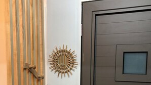 A door with a frosted glass panel, a keyhole, and a handle.
