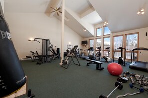 A gym with cardio machines, weightlifting equipment, and a punching bag. - North Star | Pool, Hot Tub, Ski Shuttle & Views - Tennis, Fireplace, Deck (Durango)
