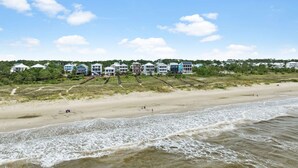A beachfront property with multiple houses, a sandy beach, and a railway track. - Beachfront Home w/ Private Boardwalk (Port St. Joe)