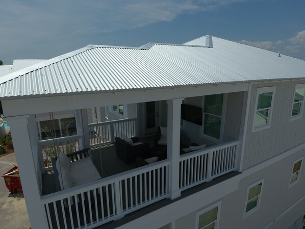 A two-story house with a covered porch and a balcony. - Santa Rosa Beach Blonde~ New with Elevator (Santa Rosa Beach)