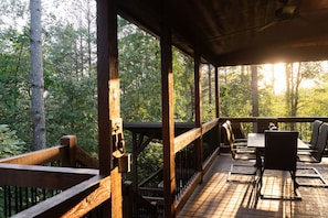 Enjoy dining or socializing on the deck, surrounded by the forest.