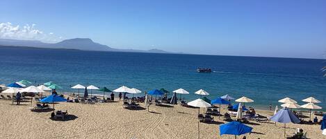 On the beach, sun-loungers, beach towels