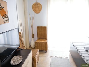 Panoramic Triple Room | Living area | Flat-screen TV