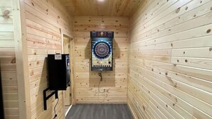 A narrow, wooden-paneled room with a dartboard mounted on the wall. - Bluegill Bungalow-9 Miles To Dells, Pet Friendly (Briggsville)