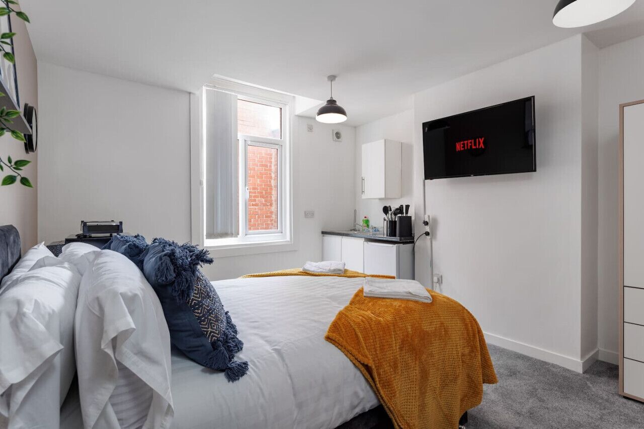 1 bedroom, desk, iron/ironing board, travel cot