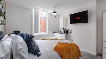 1 bedroom, desk, iron/ironing board, travel crib