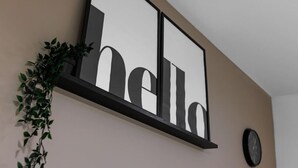A wall-mounted sign with the word "hello" in large letters.