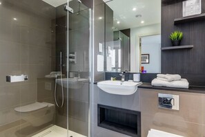 Shower, hair dryer, towels, toilet paper