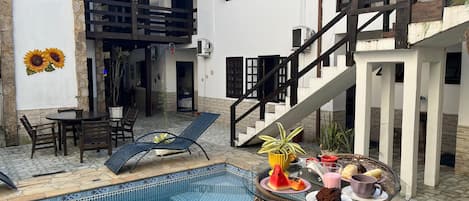 Outdoor pool, open 10:00 AM to 10:00 PM, pool umbrellas, sun loungers