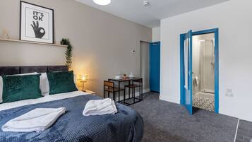 1 bedroom, desk, iron/ironing board, travel crib