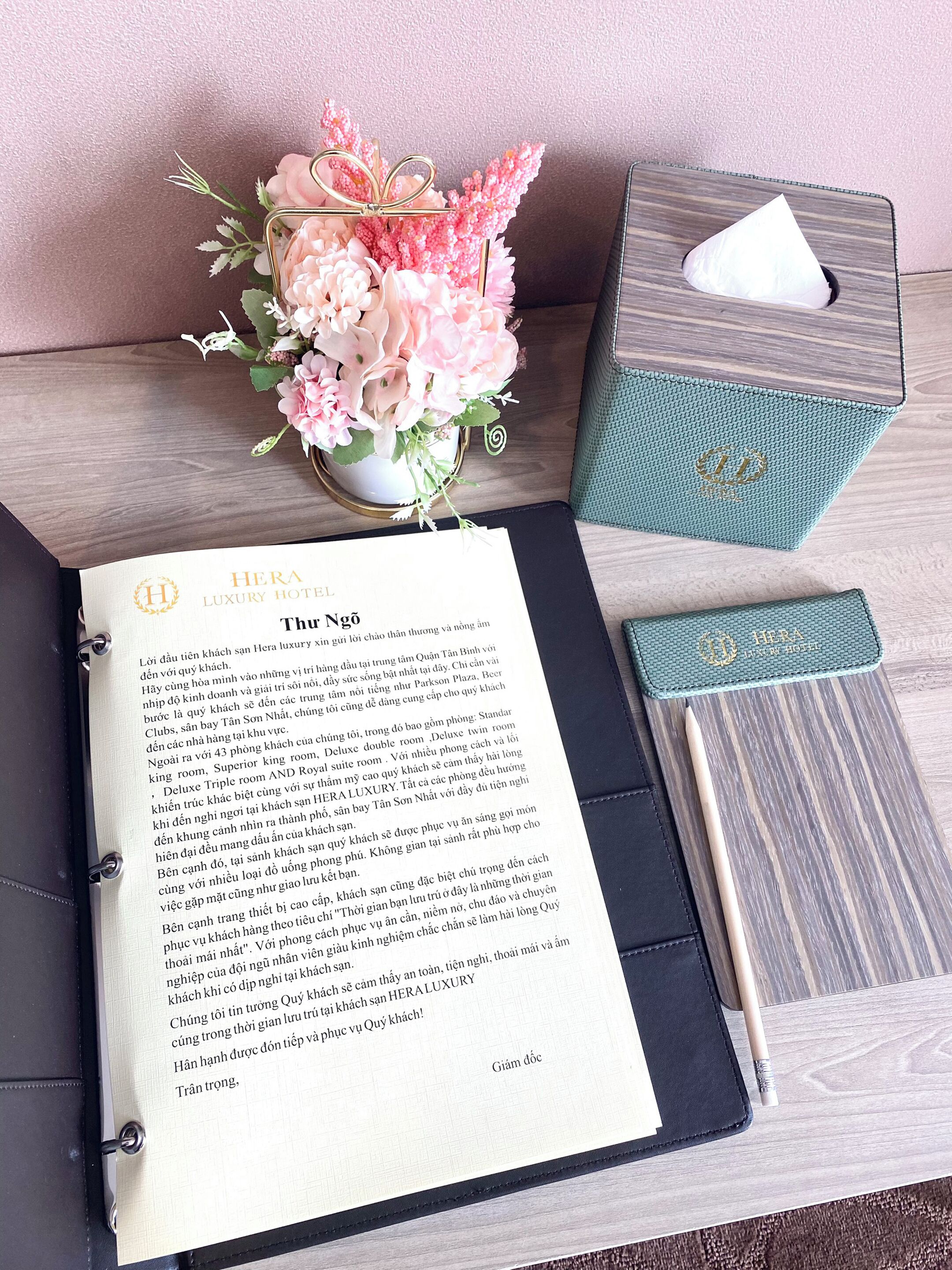 A hotel brochure titled "Hera Luxury Hotel" with a description of the hotel.