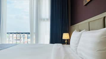 Deluxe Room, 1 King Bed, City View | 1 bedroom, premium bedding, minibar, in-room safe