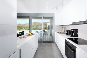 Microwave, oven, dishwasher, dining tables