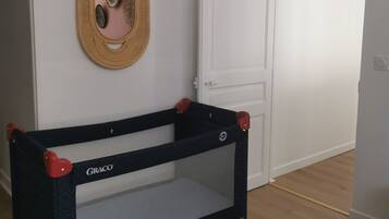 1 bedroom, desk, iron/ironing board, travel crib