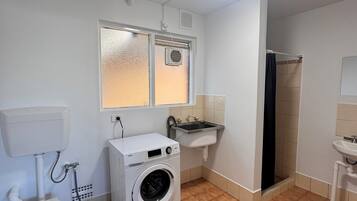 Shower, towels, soap, toilet paper