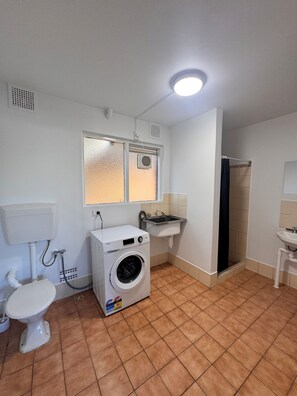 Shower, towels, soap, toilet paper